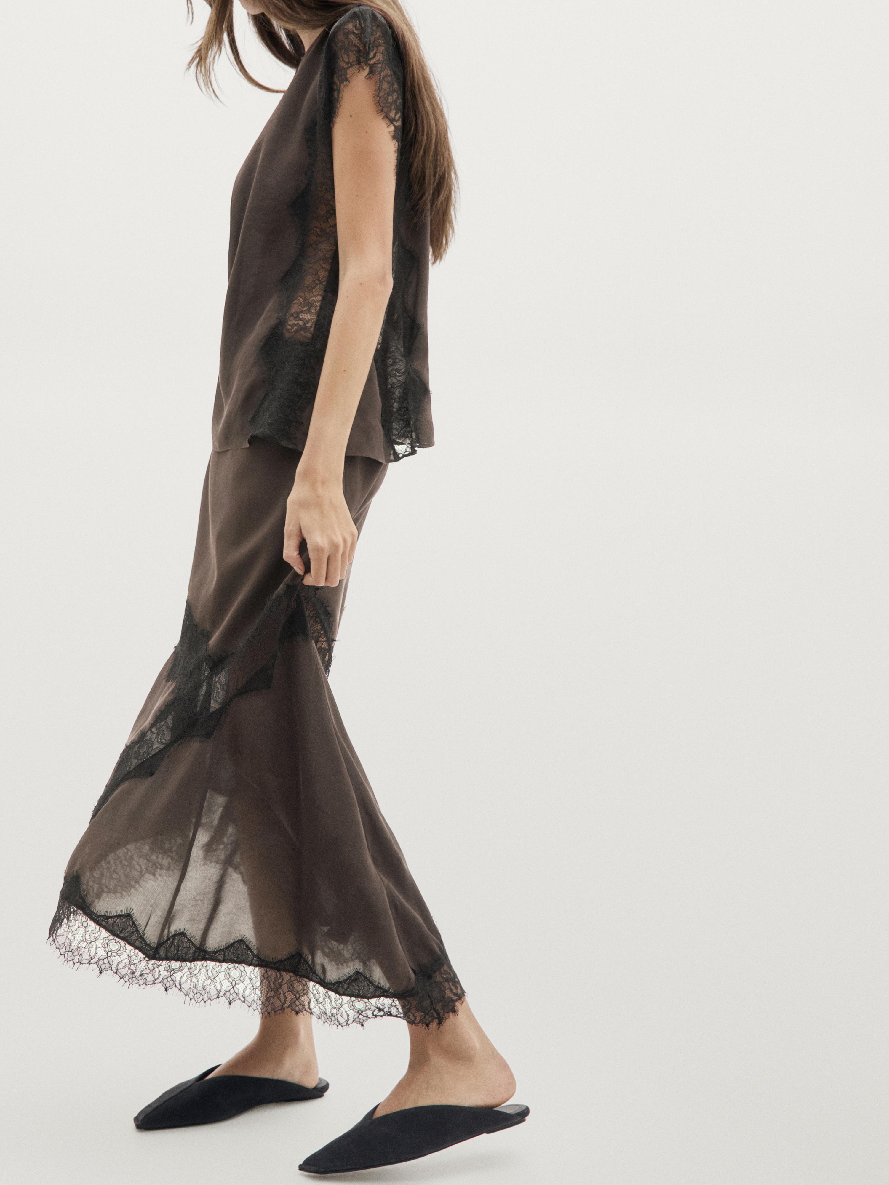 Flowing asymmetric midi skirt with lace detail